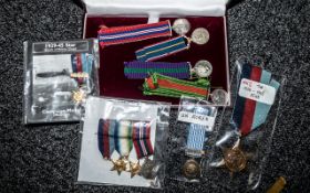 A Collection of Nine WWi and WWII Miniature Medals, together with a 1939-45 Star.