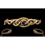 Victorian Period 1837 - 1910 Superb 9ct Gold Sapphire Set Ornate / Hollow Bangle with Safety Chain.