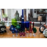 Collection of Coloured Glassware, comprising a 19" blue glass vase, an 11" green glass vase,