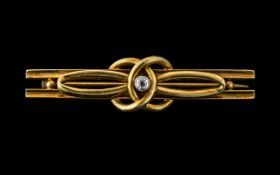 A 15ct Gold Diamond Set Brooch of Knot F