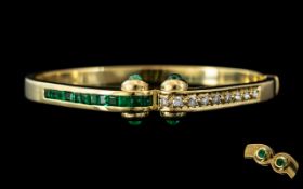 An 18ct Gold Emerald and Diamond Hinged