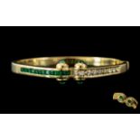 An 18ct Gold Emerald and Diamond Hinged