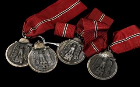 Third Reich Nazi German Medals: four Winterschlacht im Osten 1941/42 Medals plus one medal ribbon
