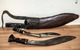 Two Antique Gurkha Knives, one with leather scabbard.