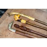 Four Vintage Walking Sticks, comprising sticks with decorative handles including a British Bulldog,