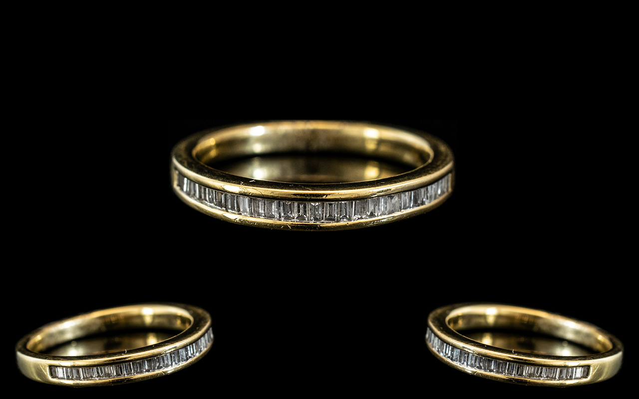 An 18ct Gold Diamond Set Half Eternity Ring channel set baguette cut diamonds, fully hallmarked.
