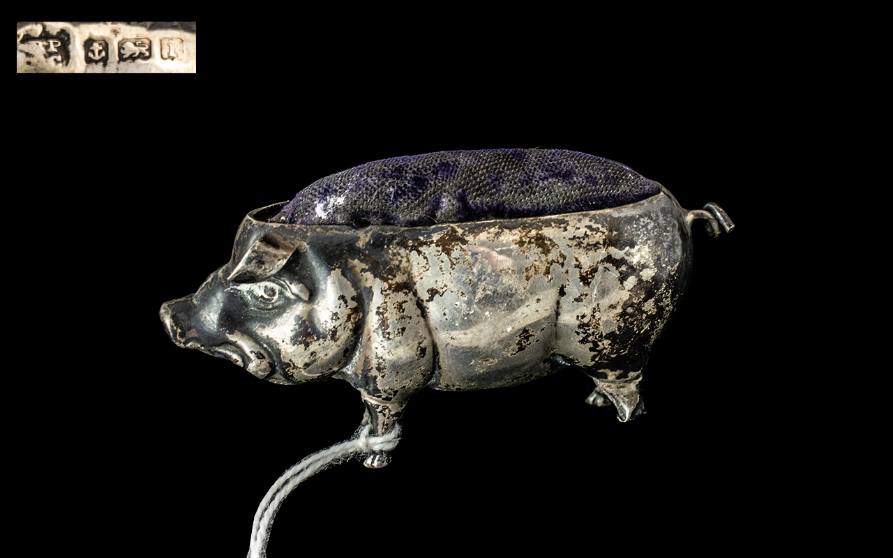 A Silver Pin Cushion in the Form of a Pig, of typical form, hallmarked for Birmingham I, 1908.