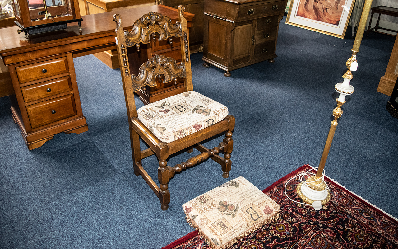 A Bedroom/Hall Chair in Oak, heavily carved in the Priory style,