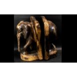 Large Antique Wooden Bookends in the form of elephants,