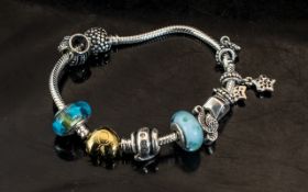 Pandora Charm Bracelet with a collection of various charms.