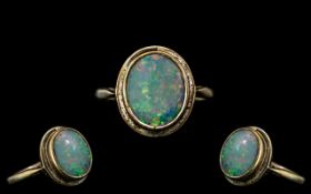 9ct Gold Attractive Opal Set Ring. The Large Opal of Good Colours. Est Weight 2.5 cts. Ring Size Q.