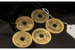 A Pouch Containing Five Chinese Metal Gaming Tokens, 4cm diameter.
