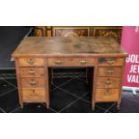 Edwardian Oak Kneehole Desk with inset leather top.