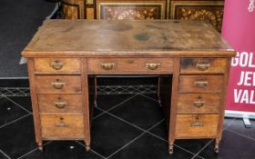Edwardian Oak Kneehole Desk with inset leather top.