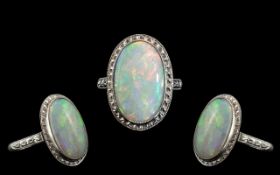 Antique Platinum Superb Opal Set Dress Ring, marked Platinum to interior of shank. The large oval