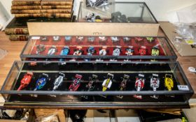 Formula One Interest - Two display cases each containing ten die cast racing car models including