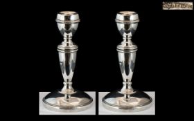Elizabeth II Fine Pair of Sterling Silver Candlesticks with Round Bases and Tapered Columns.