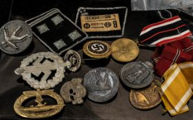 Collection of German Related Badges and cloth badges.
