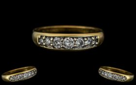 18ct Yellow Gold - Superior Quality and Attractive Seven Stone Diamond Set Dress Ring.