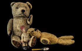 An Early 20th Century Straw Filled Jointed Teddy Bear, together with one other,