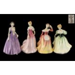 Four Royal Doulton Figures, 'Megan' HN 4790, 'Patricia' HN3907, 'Julie' HN 3878, and 'Lily' HN 3902.