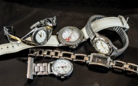 Collection of Ladies Fashion Watches, comprising DKNY bracelet watch in gold and silver tone, ladies