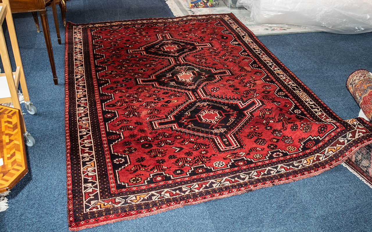 Red Ground Persian Qashqai Nomadic Rug, measures 280 x 194.