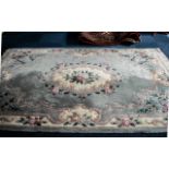 Large Quality Chinese Rug, shades of blue floral on cream background, with fringing.