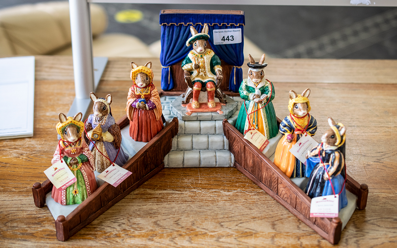 Royal Doulton 'Bunnykins' Set of Henry VIII & His Six Wives, on a Stand, comprising Henry,