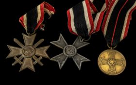 Third Reich Nazi German Medals: War Merit Cross with Swords, War Merit Cross and War Merit Medal.