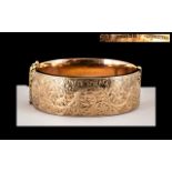 9ct Rose Gold Hinged Bangle, The Front With Chased Floral Decoration,