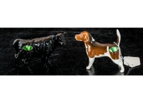 Two Beswick Figures, comprising a Black Aberdeen Angus Calf No. C1827B, and a Beswick Beagle dog.