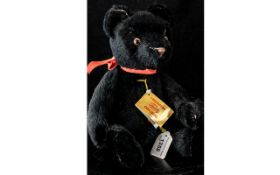 'Hermann' Black Growler Teddy Bear, Approx. 12" Tall. Black fur, medallion attached.