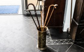 Brass Umbrella Stand 17" tall, with traditional pattern, together with five walking sticks,