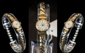 Ladies 9ct Gold Tissot Wrist Watch, white dial, Roman numerals, manual wind,