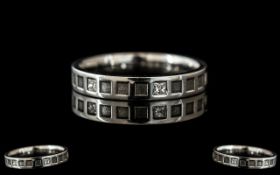 A Platinum Diamond Set Wedding/Eternity Ring, set with six princess cut diamonds, fully
