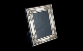 A Modern Silver Photo Frame, velvet backed and hallmarked for Sheffield 1994.
