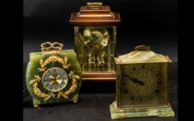 Three Mantle Clocks, comprising an Acctim wooden quartz clock with a gilt face and Roman numerals,