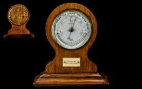 Salom & Company Good Quality Walnut Cased Desk / Table Barometer, Raised on a Stepped Base. c.1910.