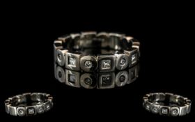 A Platinum Diamond Set Wedding/Eternity Ring, set with alternating round brilliant and princess