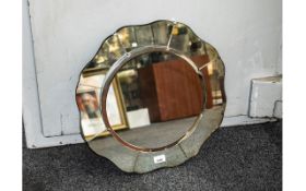 Lovely 1950s Sectional Mirror, bevelled circular front raised on eight curved outer sections.