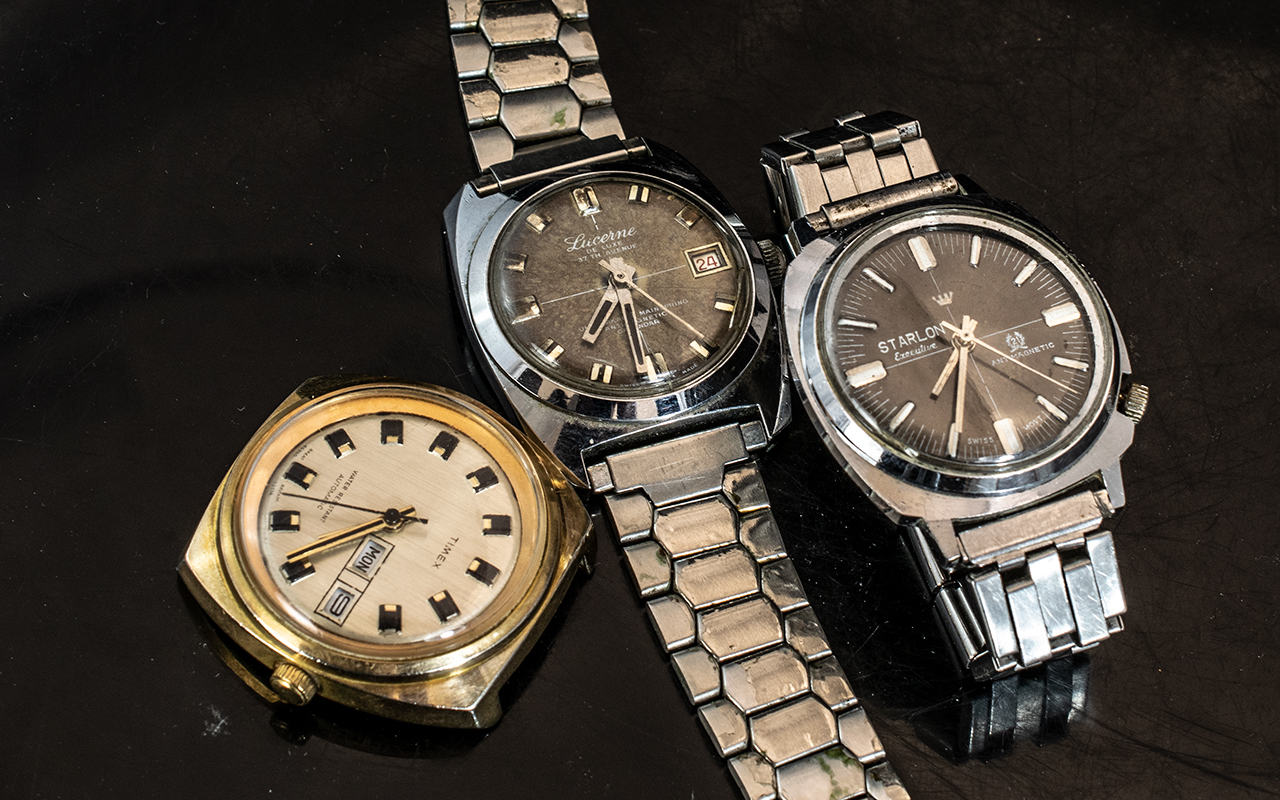 Three Gents Wrist Watches, to include a Starlon Executive manual wind, a Timex Day/Date Automatic,
