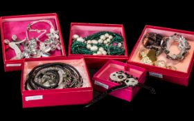 Five Boxes Containing Butler and Wilson Jewellery to include necklaces, dancing couple brooch,