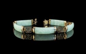 A 9ct Gold & Jadeite Bracelet, rectangular links with 9ct gold spacers. Fully hallmarked. Length 7.