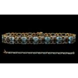 Ladies Attractive 9ct Gold Aquamarine and Diamond Set Link Bracelet, marked 9.375.