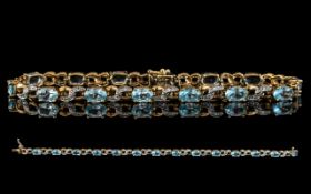 Ladies Attractive 9ct Gold Aquamarine and Diamond Set Link Bracelet, marked 9.375.