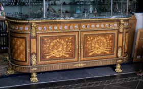 A Louis XVI Style Bow Fronted Marble Topped Sideboard with two frieze drawers with Sevres style