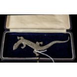 A Sterling Silver Brooch in the form of a Salamander. The whole body set with marcasites.