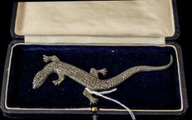 A Sterling Silver Brooch in the form of a Salamander. The whole body set with marcasites.