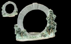 A Lladro Tableau circular garden design. Height 10 1/2 inches, 11 inches wide.